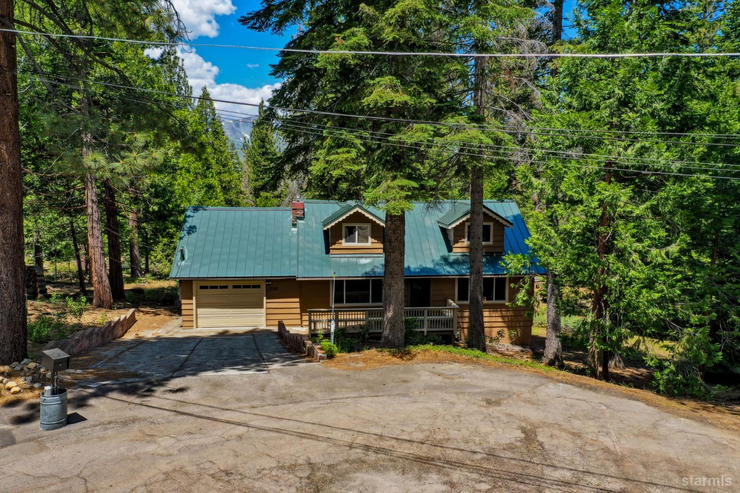 1730 Inca Way South Lake Tahoe, CA 96150 - Photo 2 of 32 a front view of a house with a yard