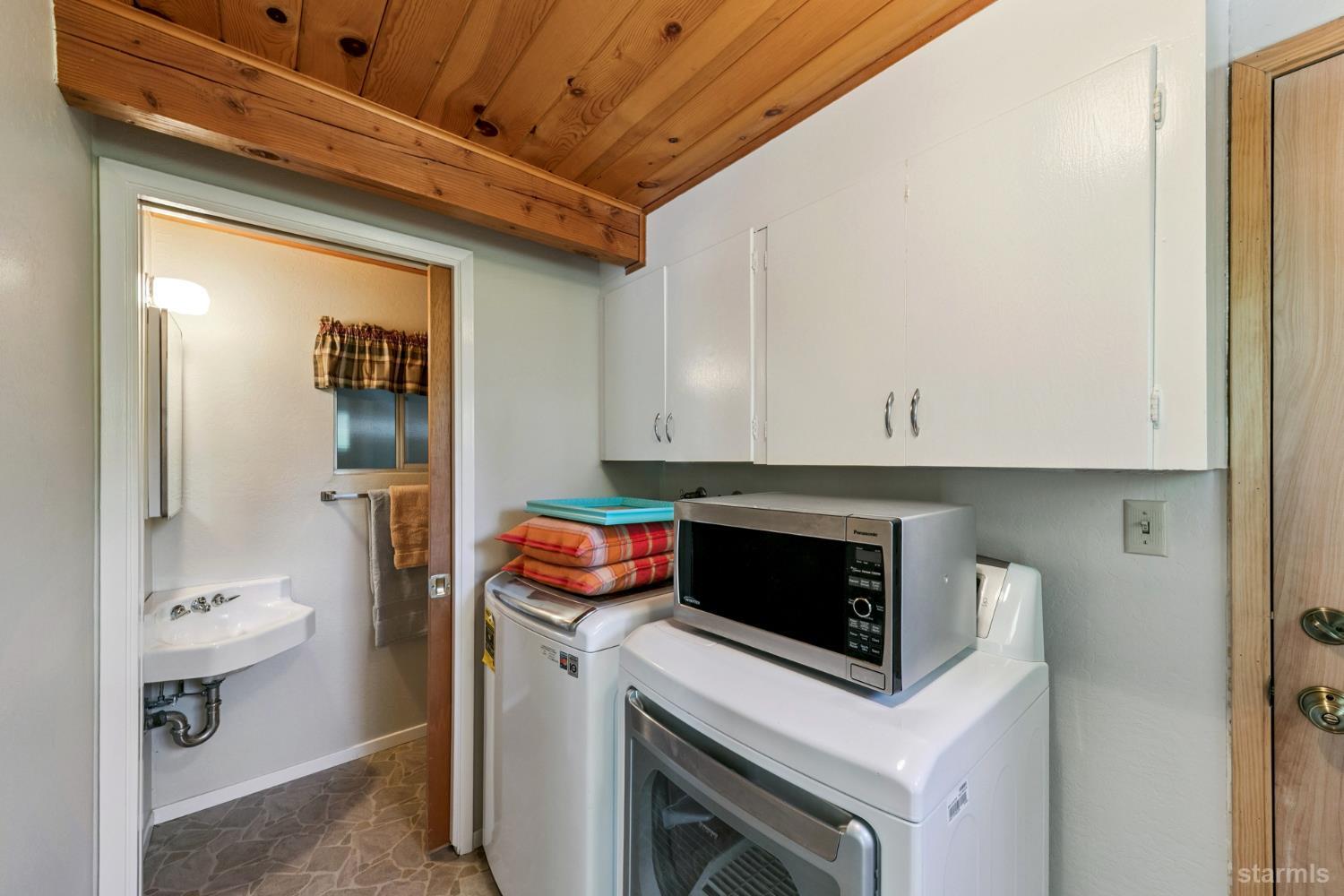 1730 Inca Way South Lake Tahoe, CA 96150 - Photo 26 of 32 a kitchen with a stove and a refrigerator