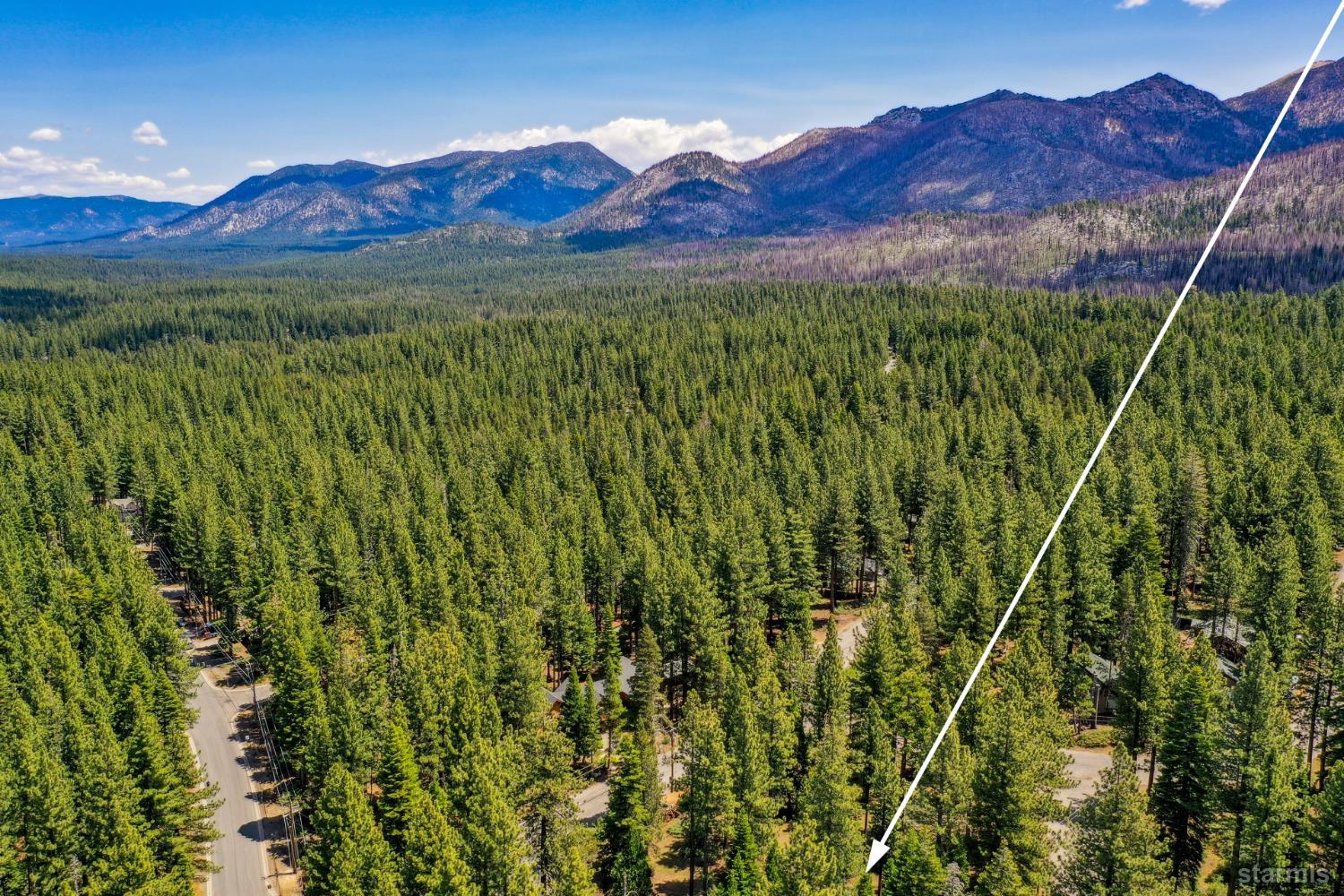 1730 Inca Way South Lake Tahoe, CA 96150 - Photo 29 of 32 a view of a lush green hillside and a building