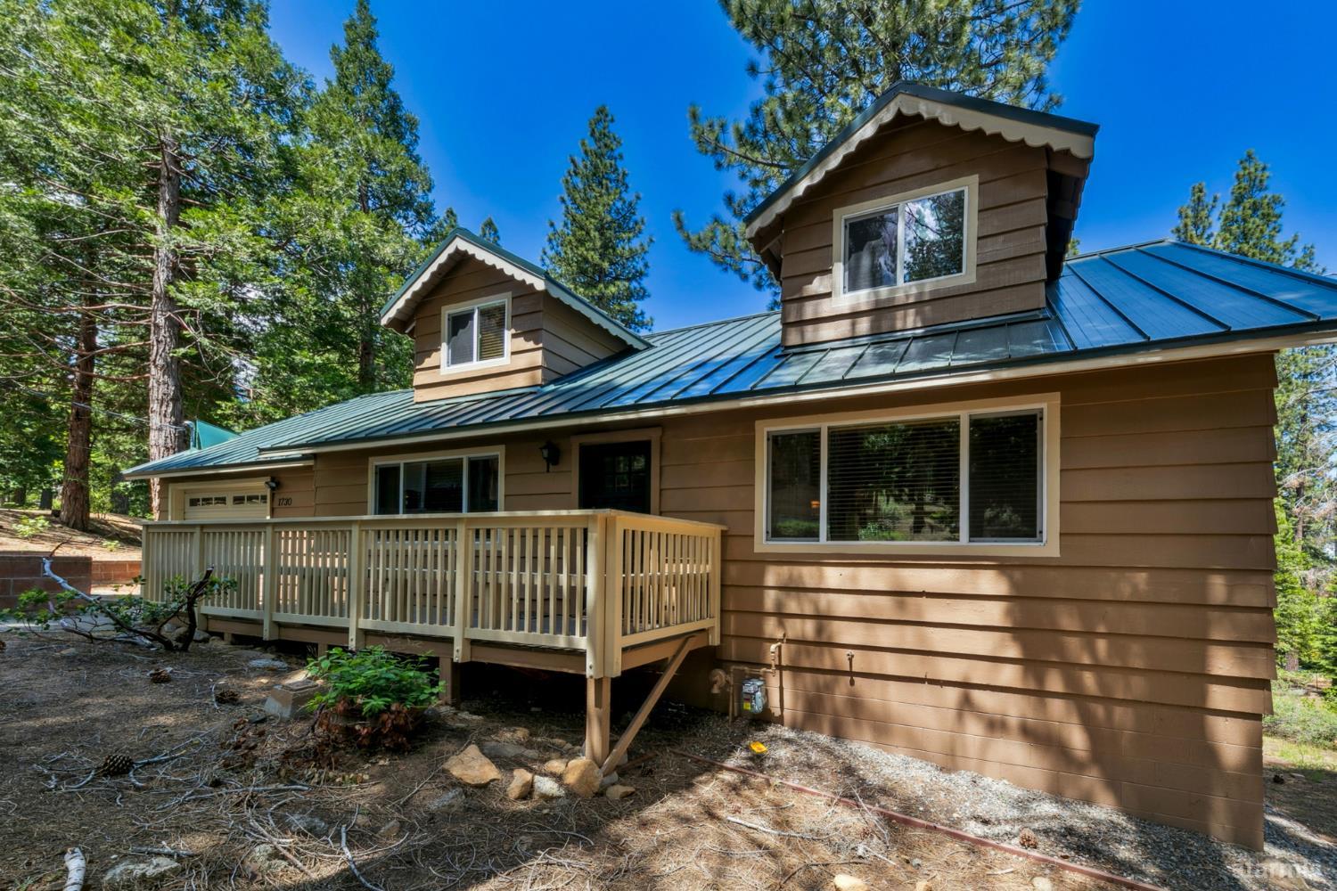 1730 Inca Way South Lake Tahoe, CA 96150 - Photo 4 of 32 a front view of a house with garden