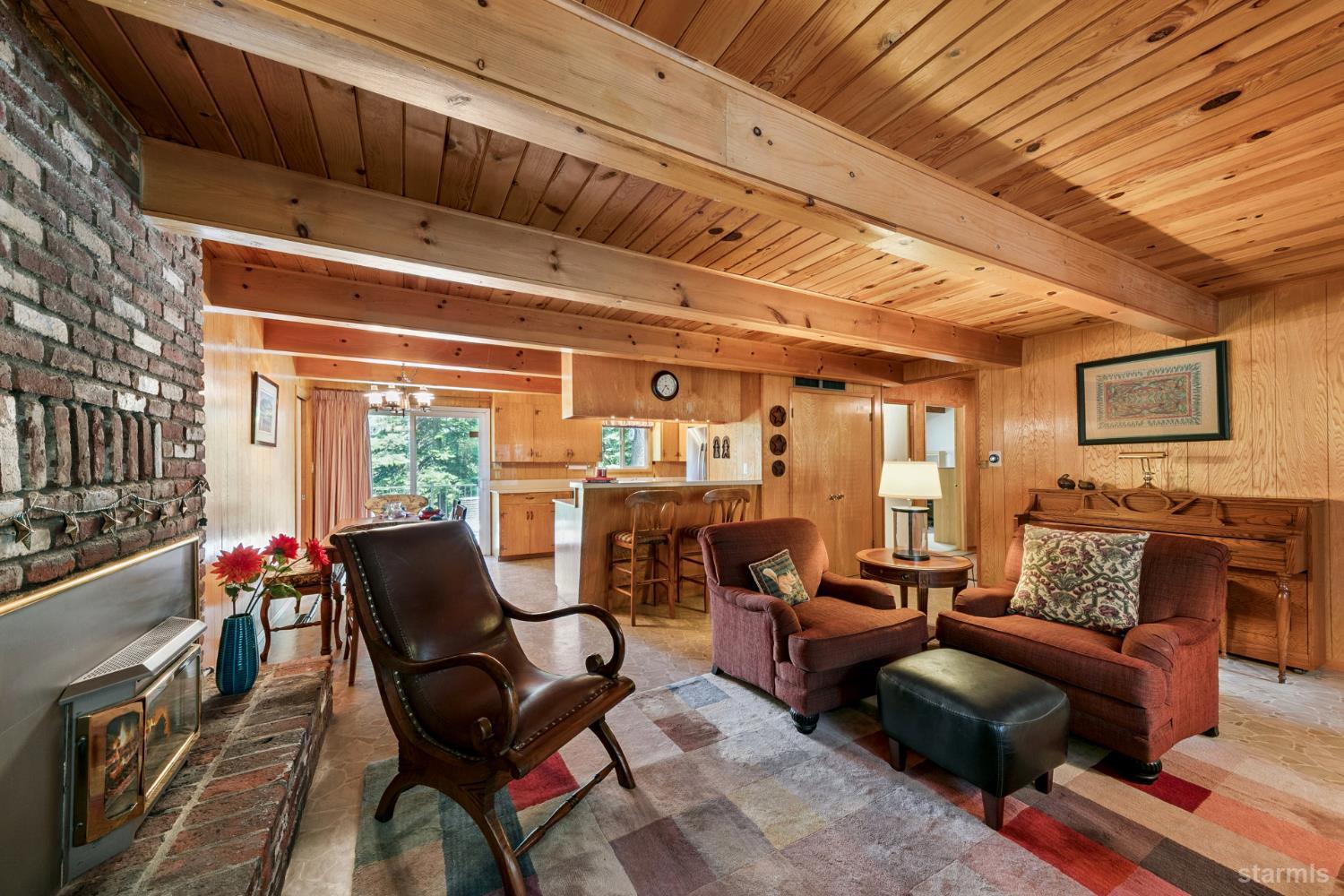 1730 Inca Way South Lake Tahoe, CA 96150 - Photo 8 of 32 a living room with furniture and a floor to ceiling window