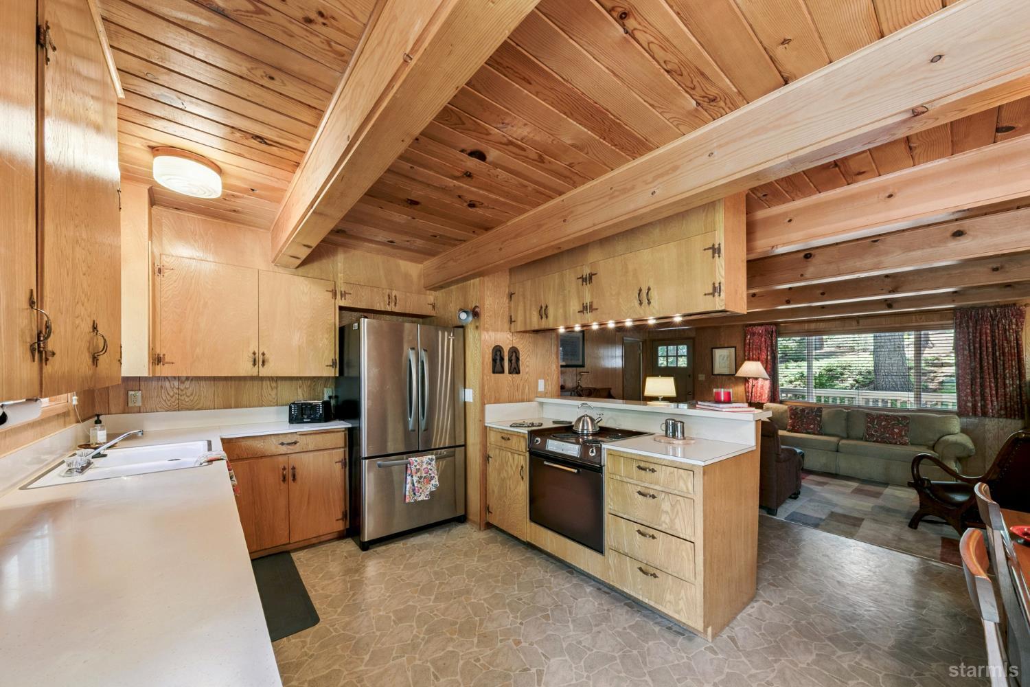 1730 Inca Way South Lake Tahoe, CA 96150 - Photo 9 of 32 a kitchen with stainless steel appliances a stove a refrigerator and a sink