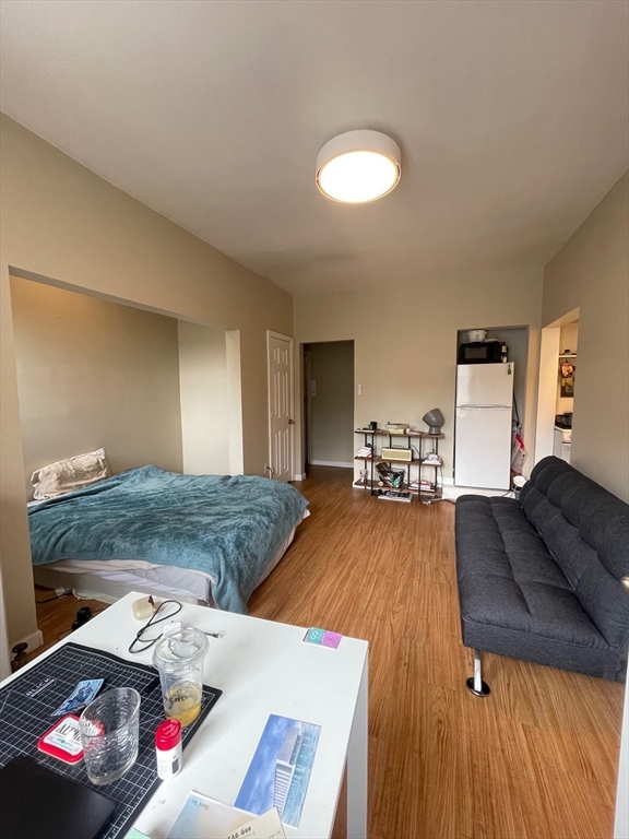65 Burbank Street, Unit 26 Boston, MA 02115 - Photo 2 of 6 a living room with furniture and a couch