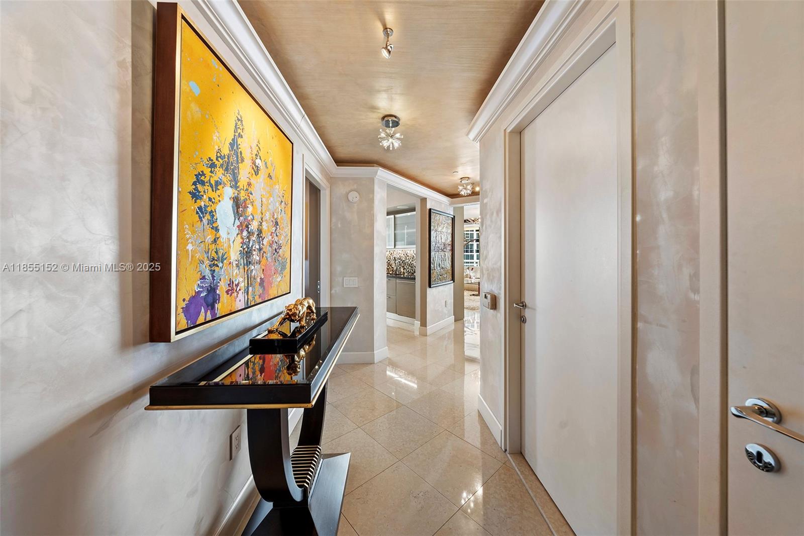 450 Alton Road, Unit 1907 Miami Beach, FL 33139 - Photo 14 of 64 a view of an entryway with wooden floor and door