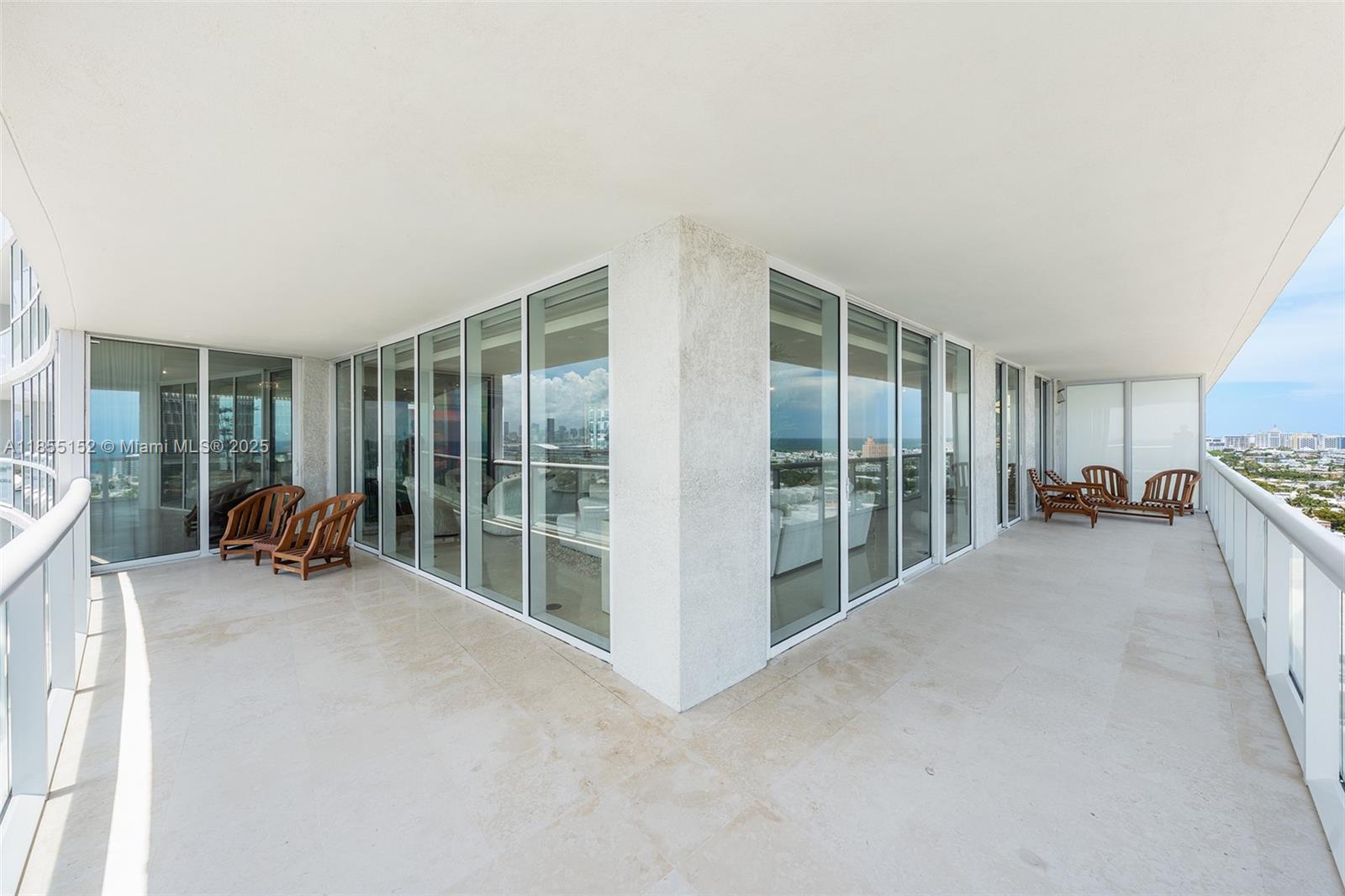 450 Alton Road, Unit 1907 Miami Beach, FL 33139 - Photo 19 of 64 a view of a room with furniture and floor to ceiling window
