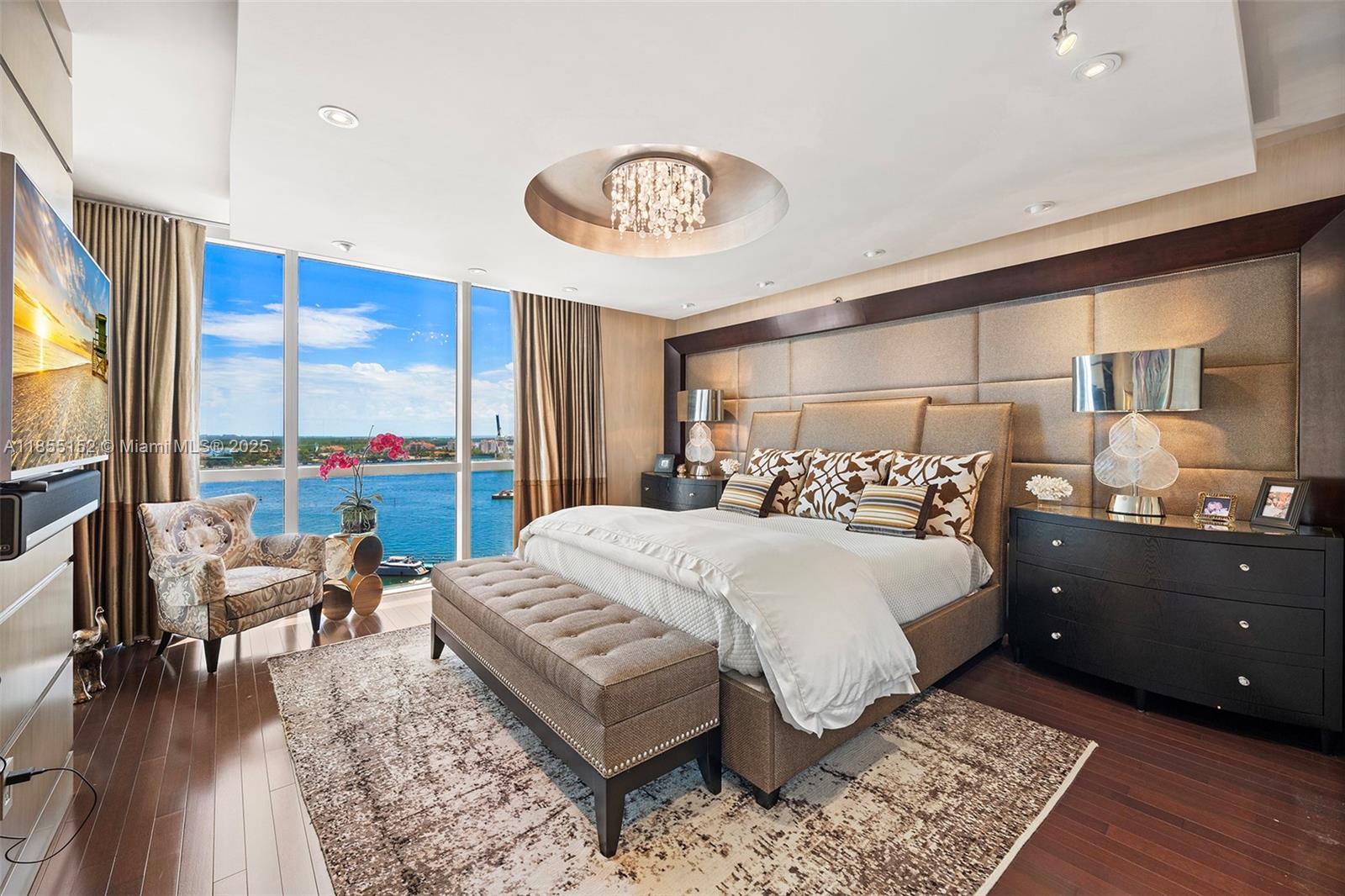 450 Alton Road, Unit 1907 Miami Beach, FL 33139 - Photo 23 of 64 a bedroom with a bed and a table