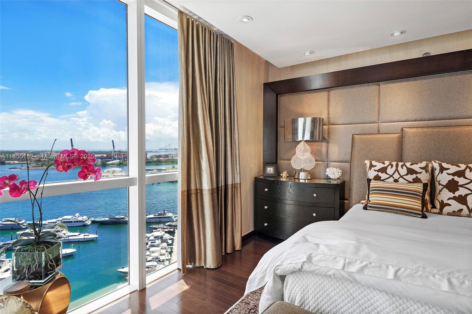 450 Alton Road, Unit 1907 Miami Beach, FL 33139 - Photo 25 of 64 a bedroom with a bed and a closet