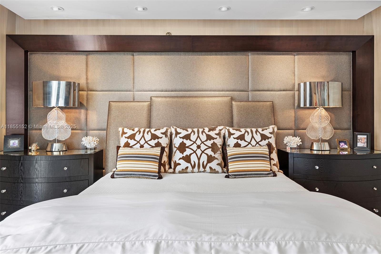 450 Alton Road, Unit 1907 Miami Beach, FL 33139 - Photo 27 of 64 a bedroom with a bed and dresser