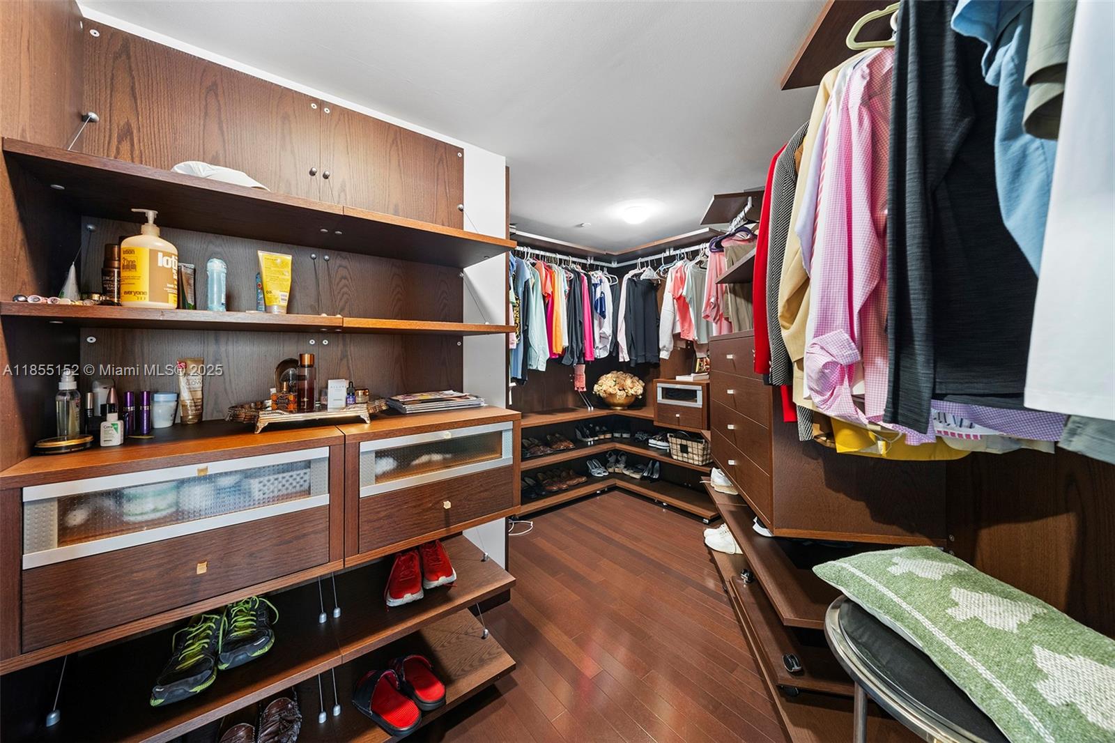 450 Alton Road, Unit 1907 Miami Beach, FL 33139 - Photo 28 of 64 a view of walk in closet with clothes and shoes