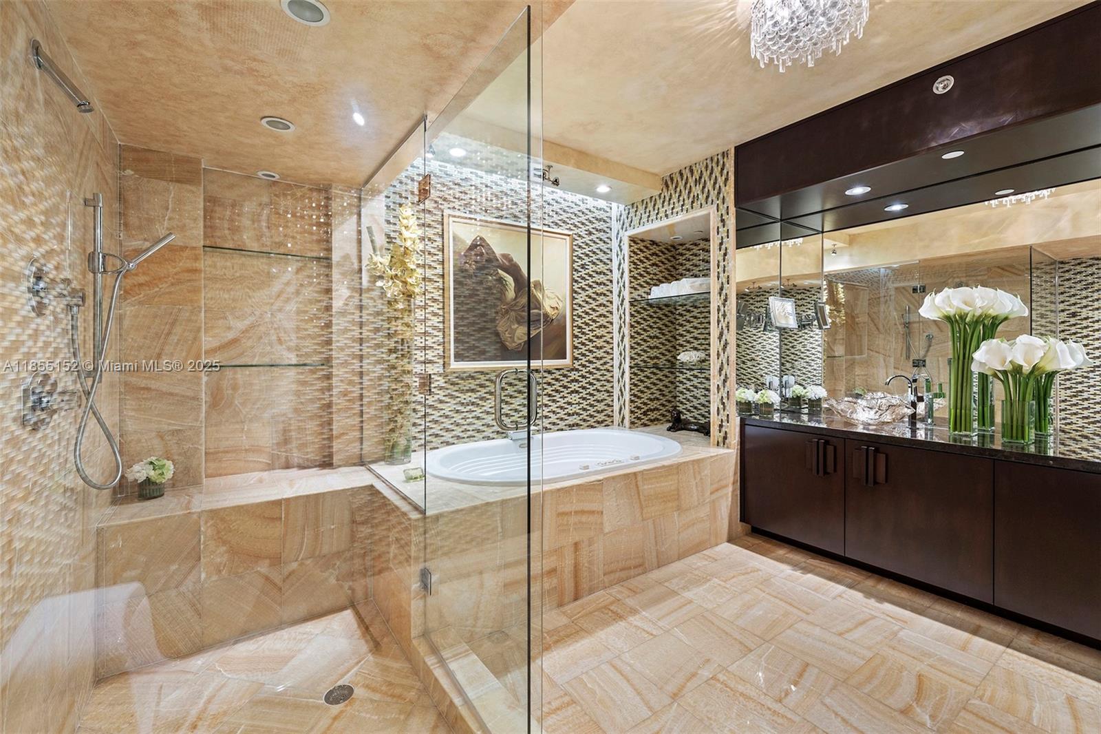 450 Alton Road, Unit 1907 Miami Beach, FL 33139 - Photo 30 of 64 a bathroom with a bathtub and a shower