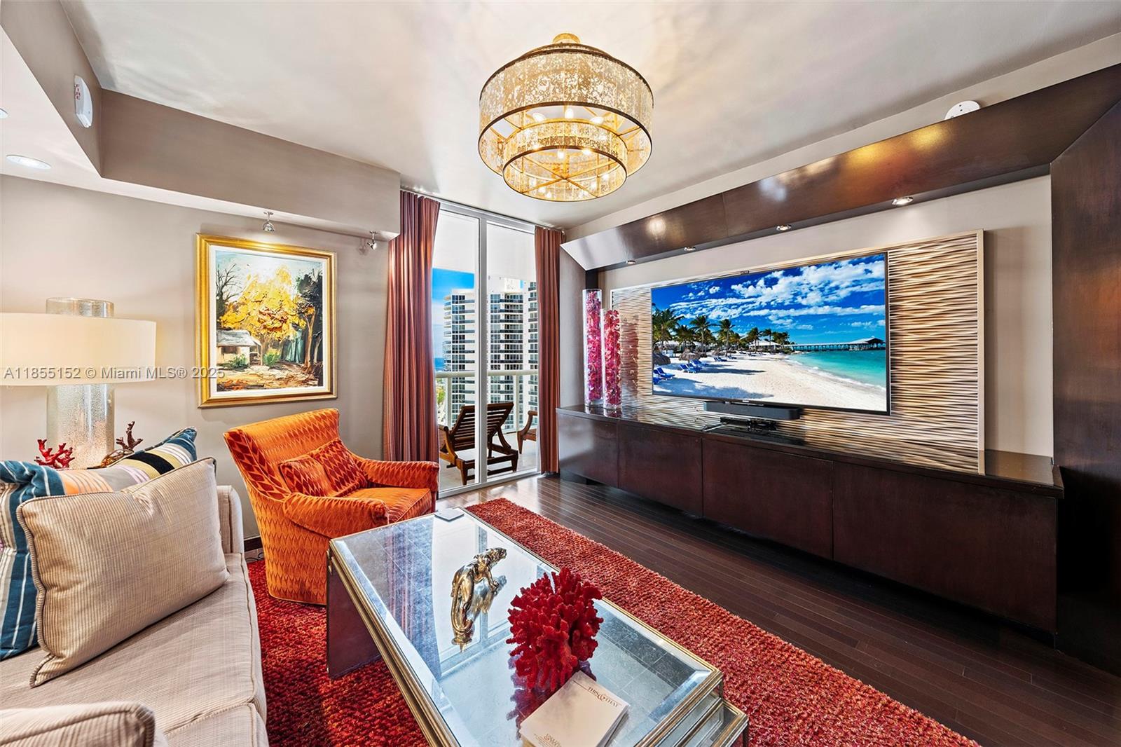 450 Alton Road, Unit 1907 Miami Beach, FL 33139 - Photo 35 of 64 a living room with furniture and a flat screen tv