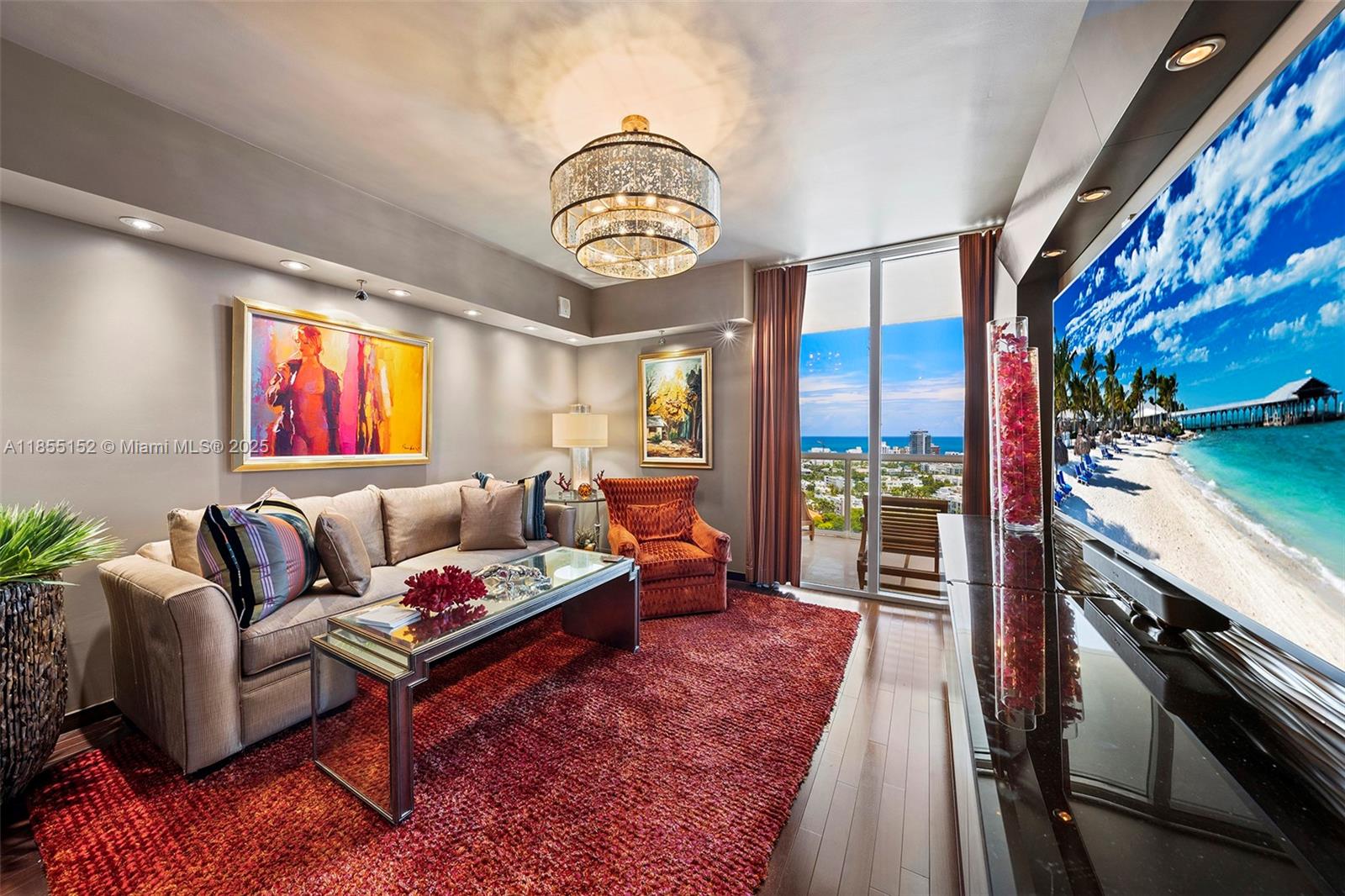 450 Alton Road, Unit 1907 Miami Beach, FL 33139 - Photo 36 of 64 a living room with furniture a floor to ceiling window and a table
