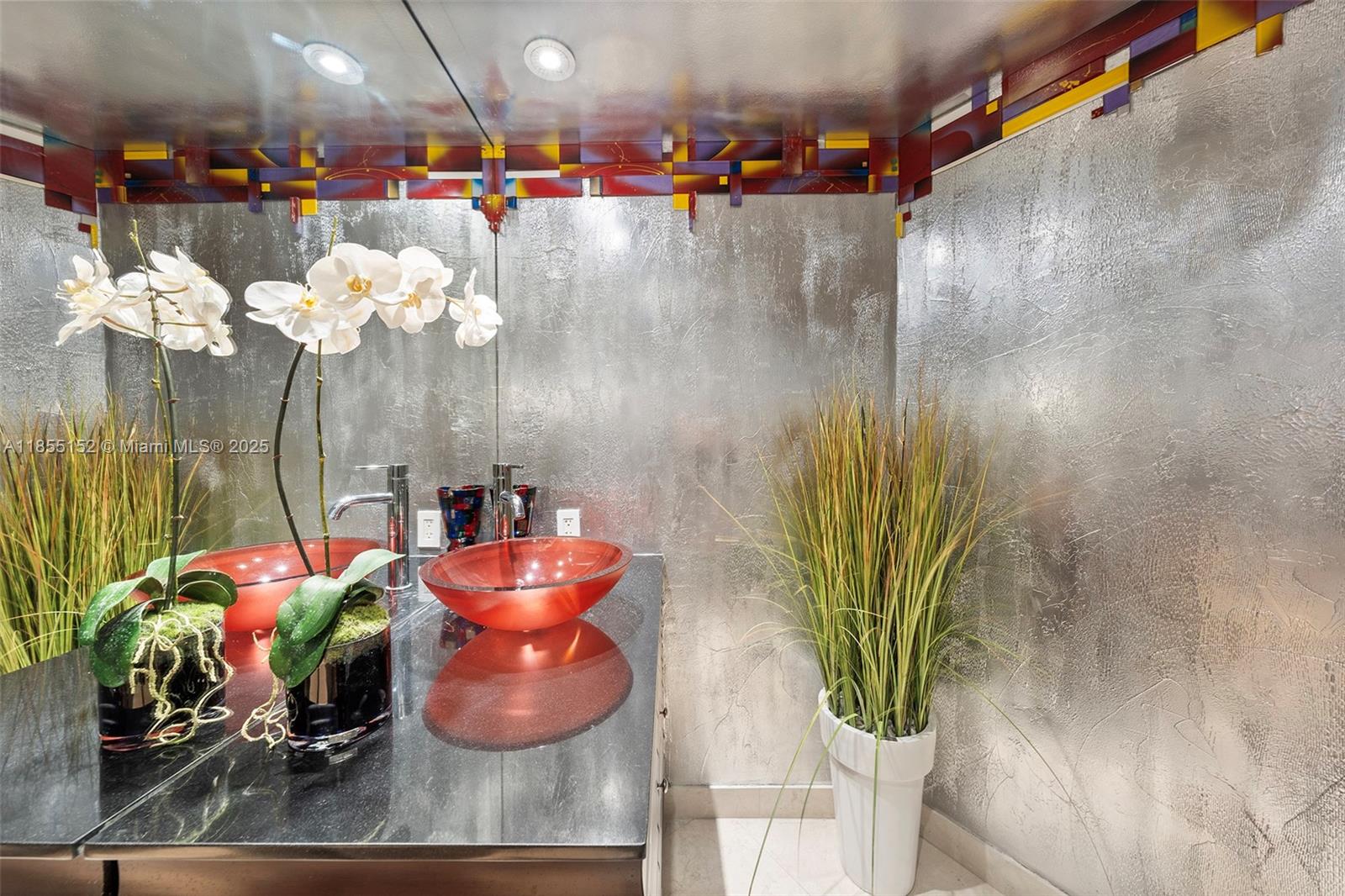 450 Alton Road, Unit 1907 Miami Beach, FL 33139 - Photo 38 of 64 a vase of flowers sitting on a table