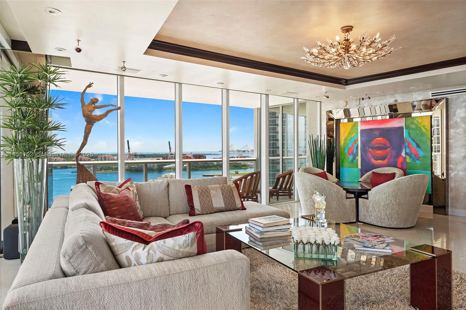 450 Alton Road, Unit 1907 Miami Beach, FL 33139 - Photo 4 of 64 a living room with furniture and a potted plant