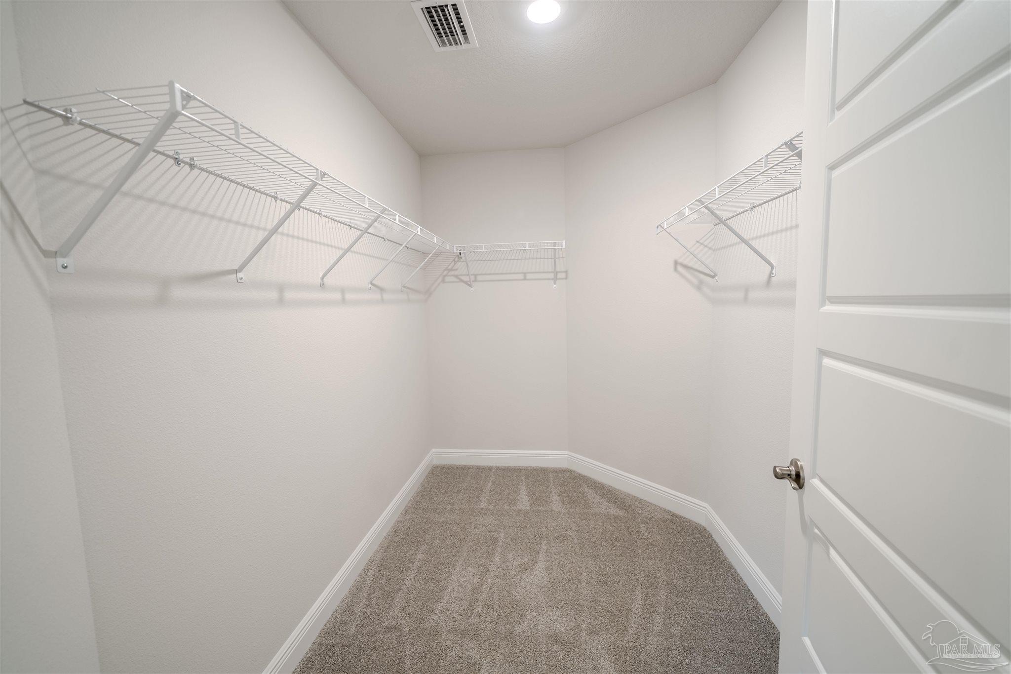 1730 Leigh Loop, Unit 18D Cantonment, FL 32533 - Photo 12 of 18 a view of a room with racks on the wall