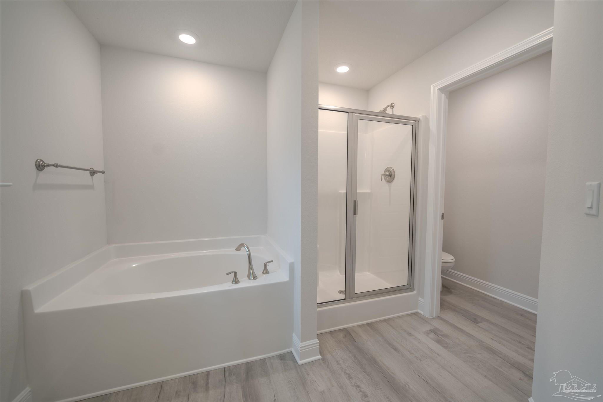1730 Leigh Loop, Unit 18D Cantonment, FL 32533 - Photo 13 of 18 a bathroom with a bathtub and a shower