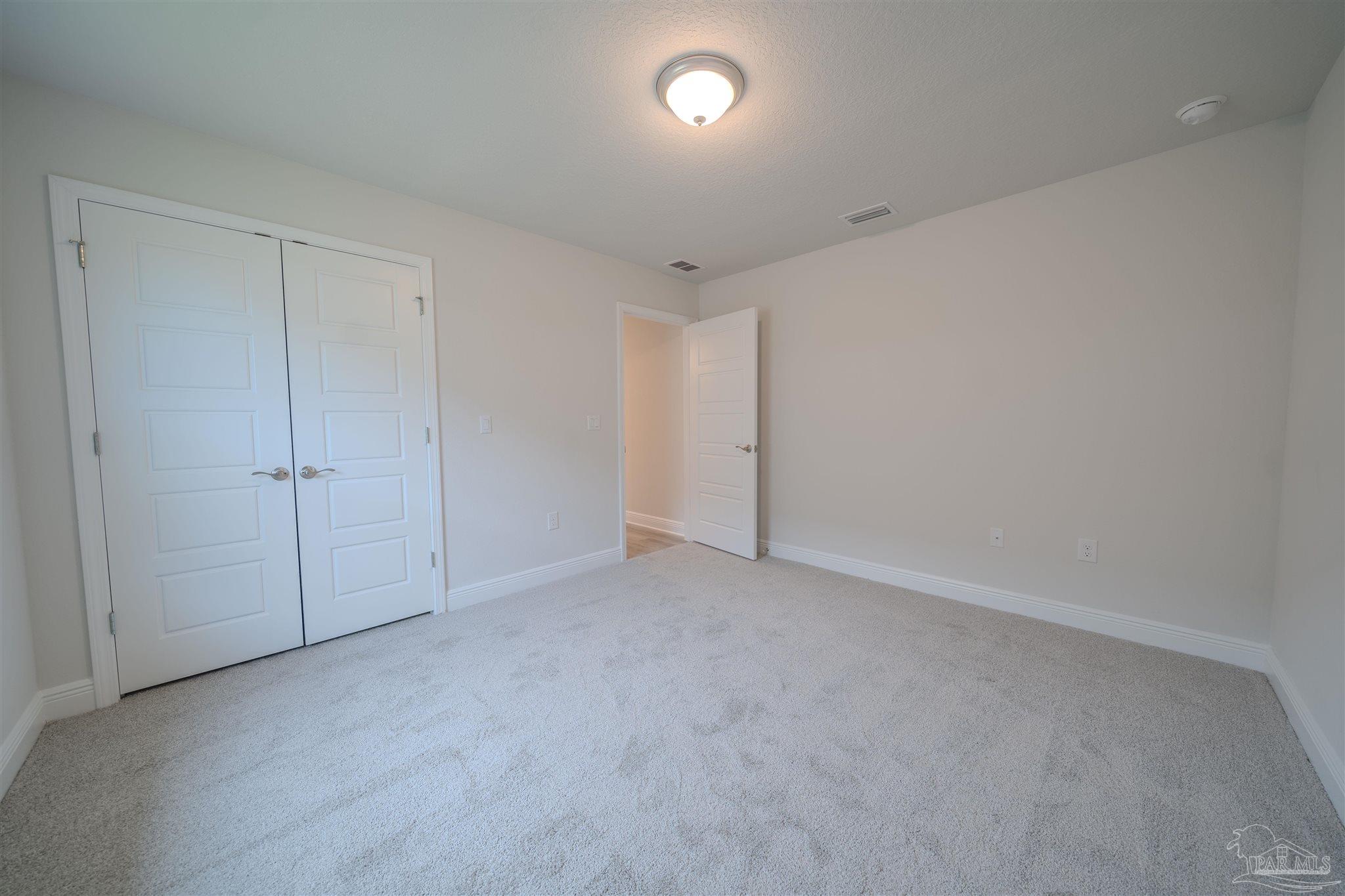 1730 Leigh Loop, Unit 18D Cantonment, FL 32533 - Photo 9 of 18 a view of an empty room