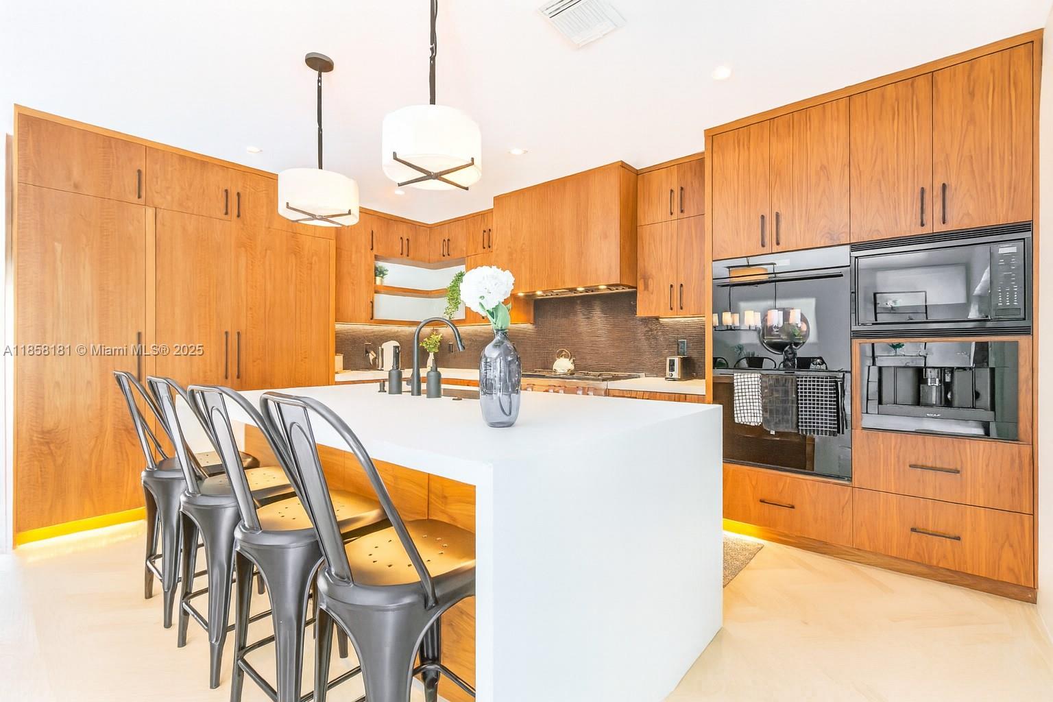 9065 Emerson Avenue Surfside, FL 33154 - Photo 16 of 50 a view of a kitchen with a large window