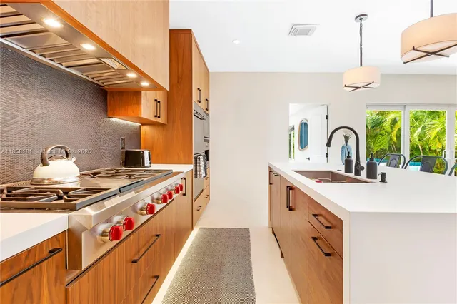 a kitchen with a stove and a sink