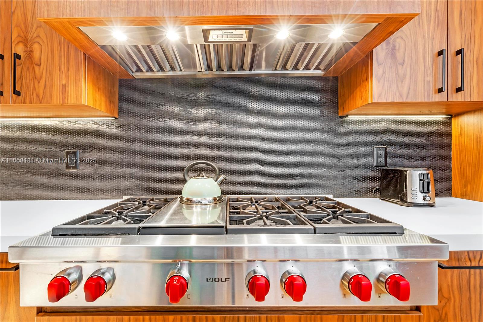 9065 Emerson Avenue Surfside, FL 33154 - Photo 21 of 50 a close view of stove and kitchen