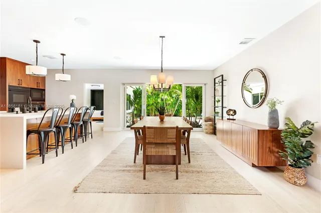 a living room with furniture a window and a dining table
