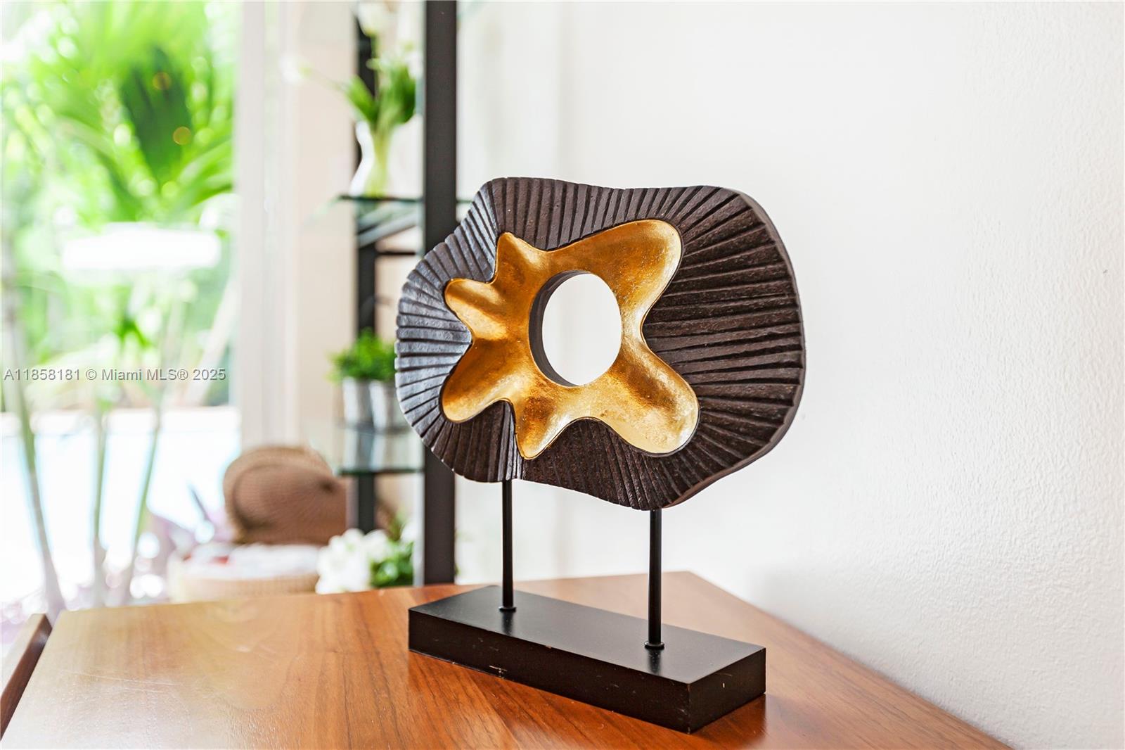 9065 Emerson Avenue Surfside, FL 33154 - Photo 23 of 50 a vase of flowers sitting on a table