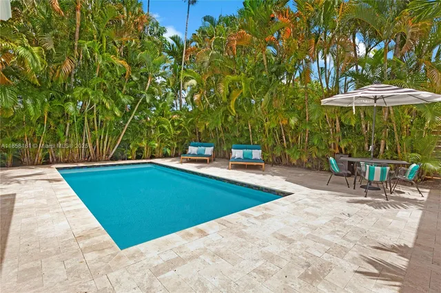 a view of a backyard with a patio