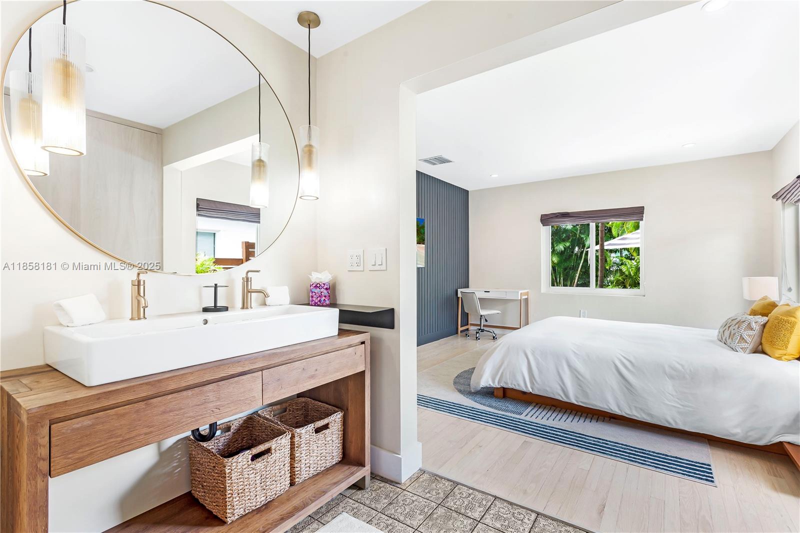 9065 Emerson Avenue Surfside, FL 33154 - Photo 32 of 50 a bedroom with a bed and a dresser