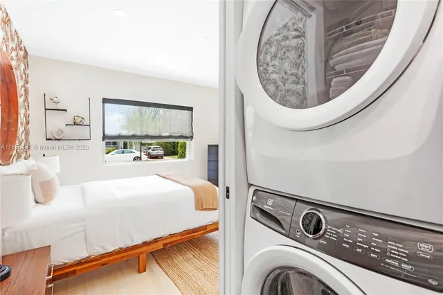 a bedroom with a bed and a mirror