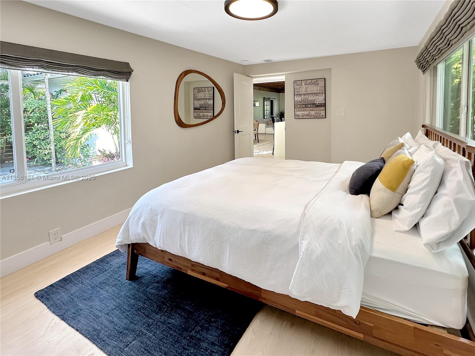 9065 Emerson Avenue Surfside, FL 33154 - Photo 41 of 50 a bedroom with a bed and a window