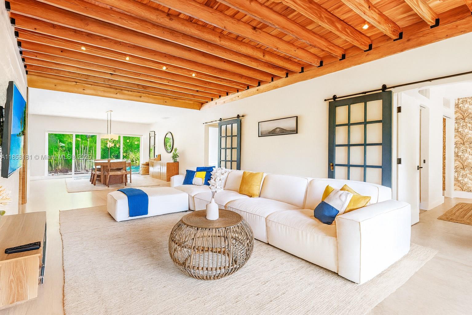 9065 Emerson Avenue Surfside, FL 33154 - Photo 7 of 50 a living room with furniture and a large window