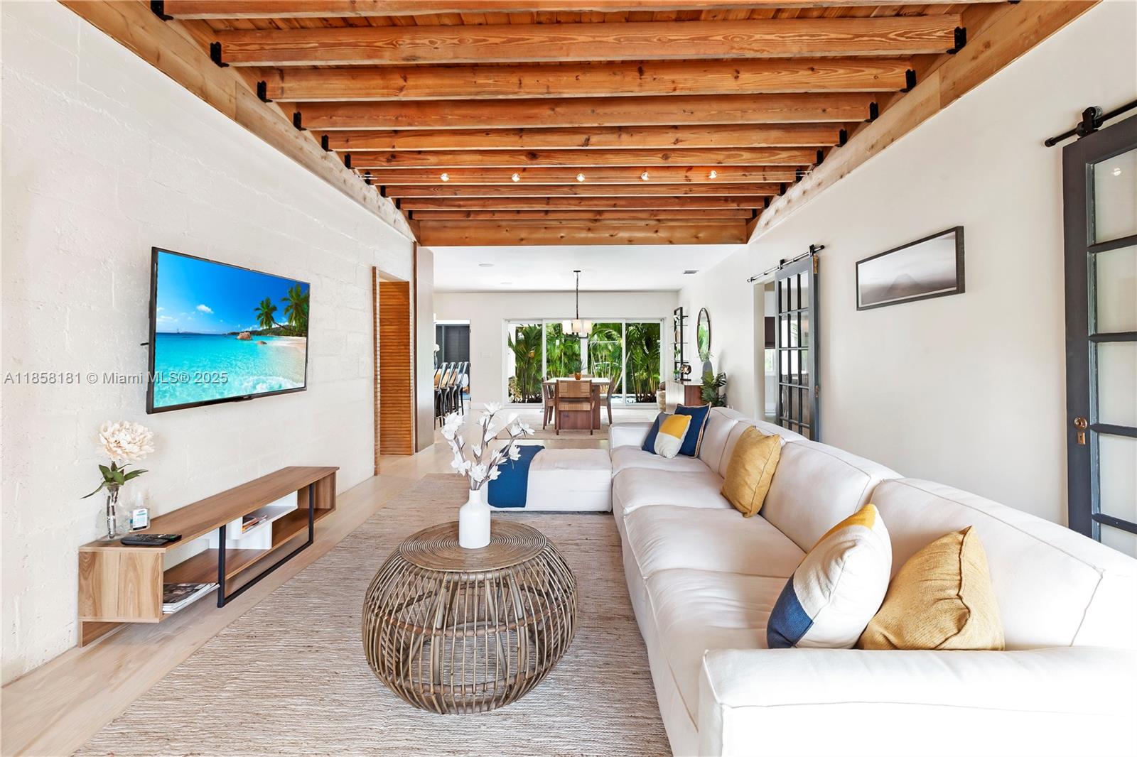 9065 Emerson Avenue Surfside, FL 33154 - Photo 9 of 50 a living room with furniture and a wooden floor
