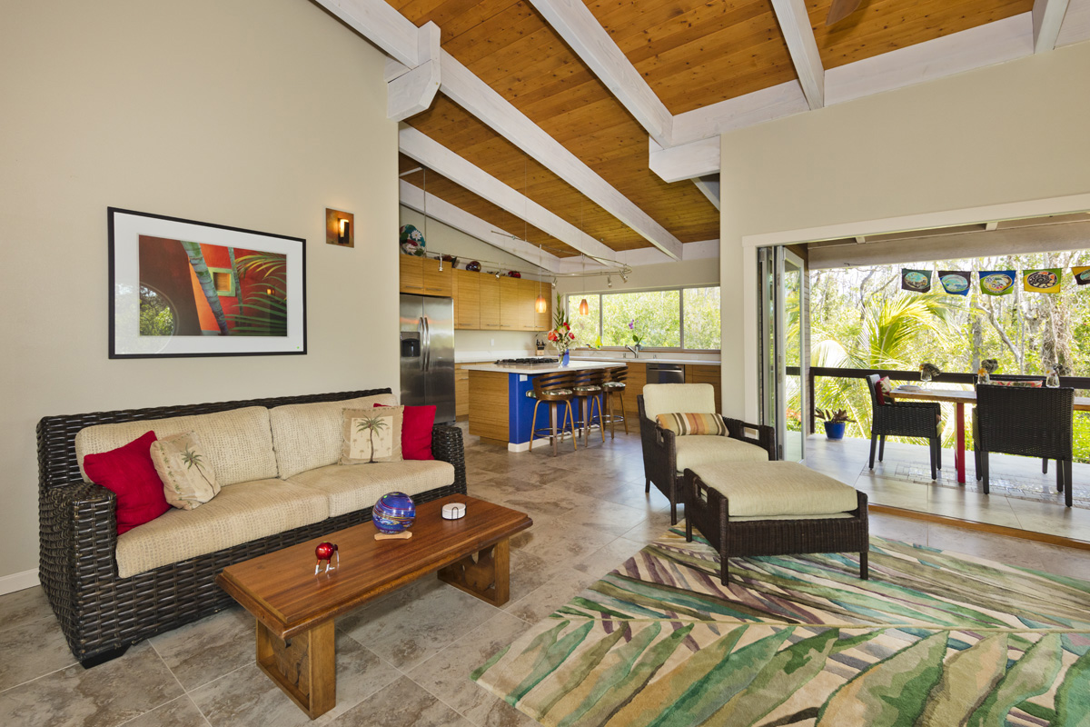 12-7002 Ho'Eunalu Street Pahoa, HI 96778 - Photo 12 of 26 a living room with furniture and a floor to ceiling window