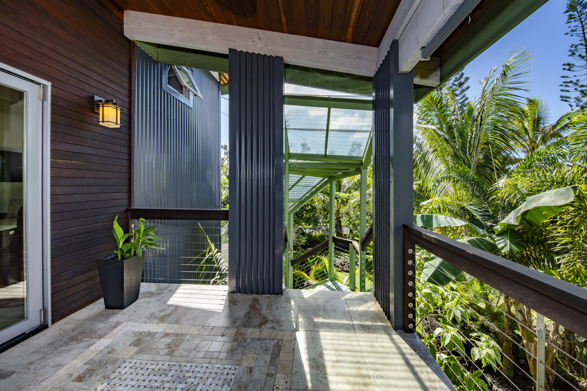 12-7002 Ho'Eunalu Street Pahoa, HI 96778 - Photo 13 of 26 a view of a balcony with potted plants