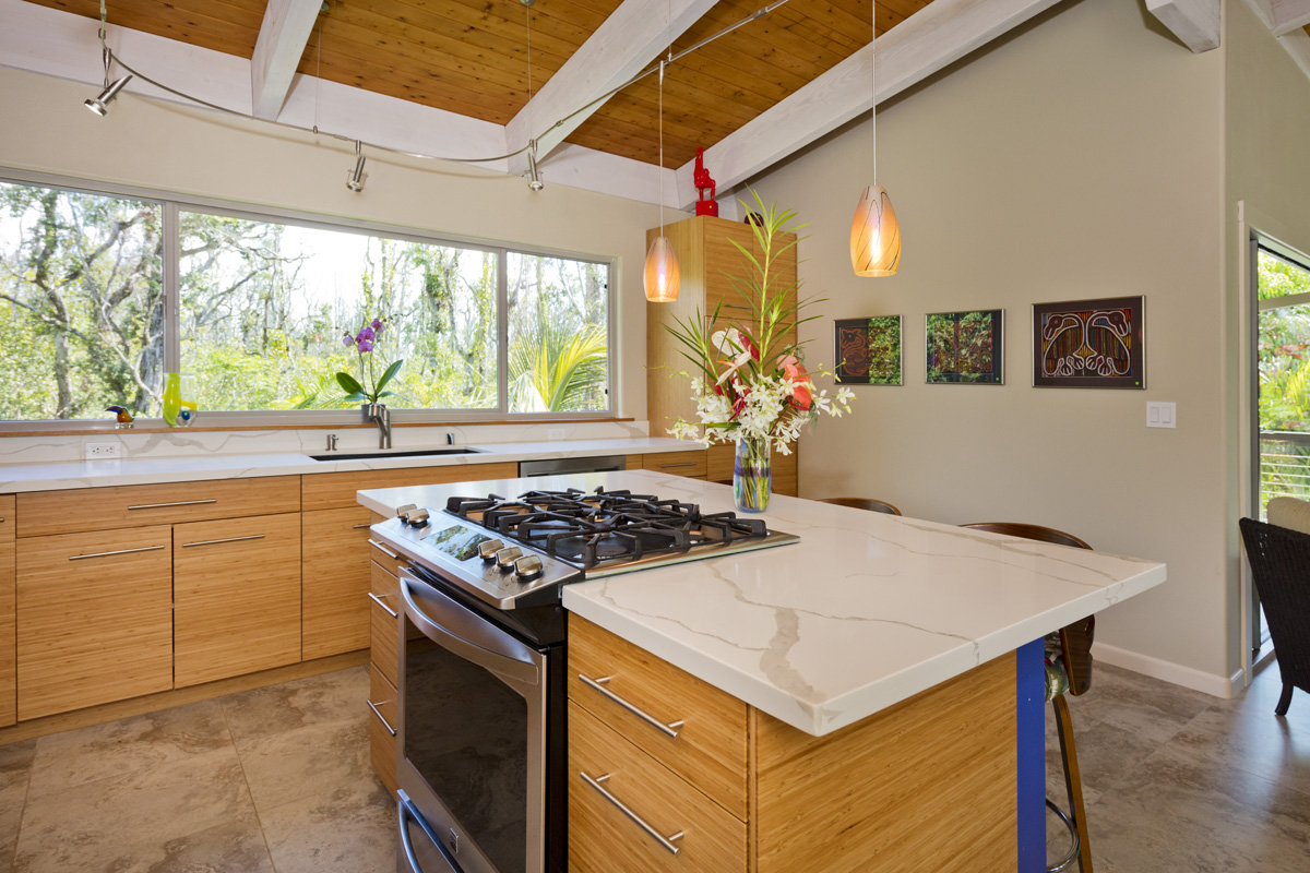 12-7002 Ho'Eunalu Street Pahoa, HI 96778 - Photo 15 of 26 a kitchen with a stove a sink and a refrigerator