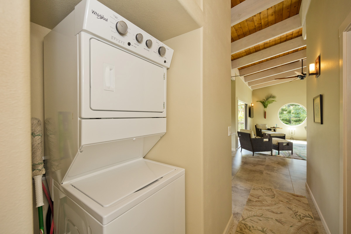 12-7002 Ho'Eunalu Street Pahoa, HI 96778 - Photo 16 of 26 a utility room with dryer and washer