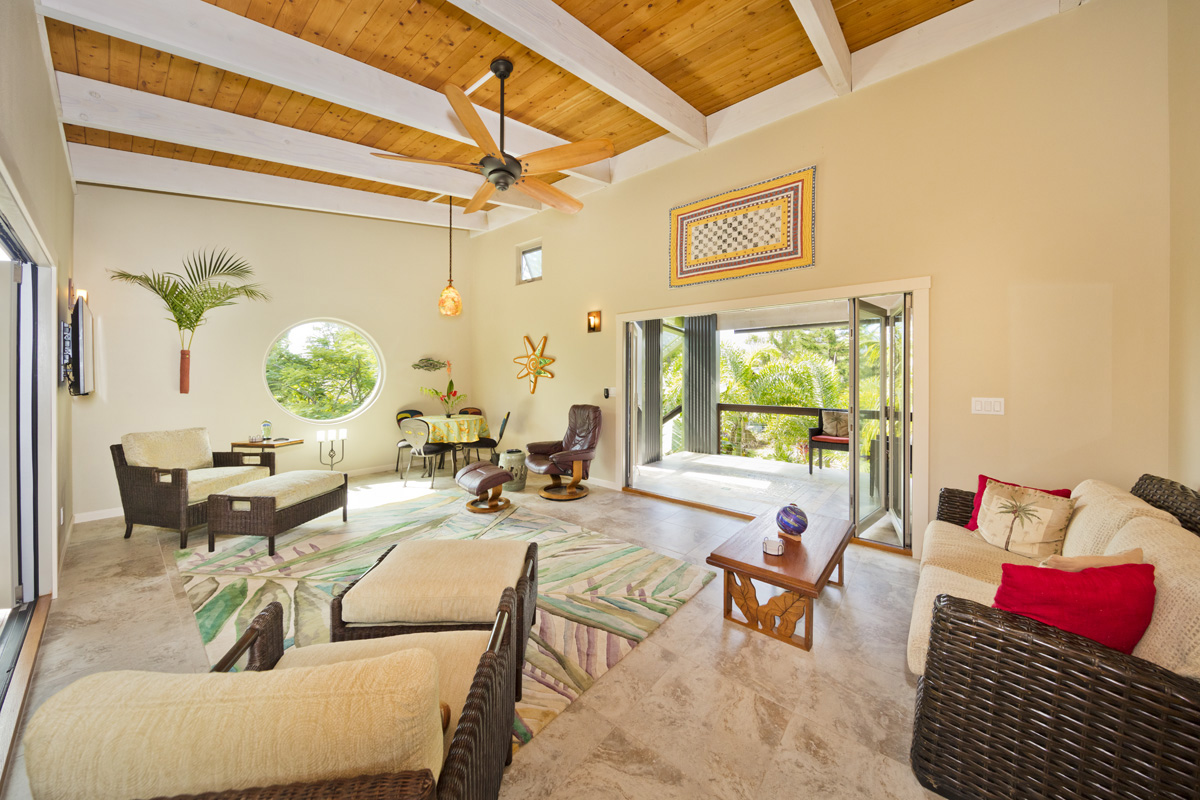 12-7002 Ho'Eunalu Street Pahoa, HI 96778 - Photo 17 of 26 a living room with furniture and a large window