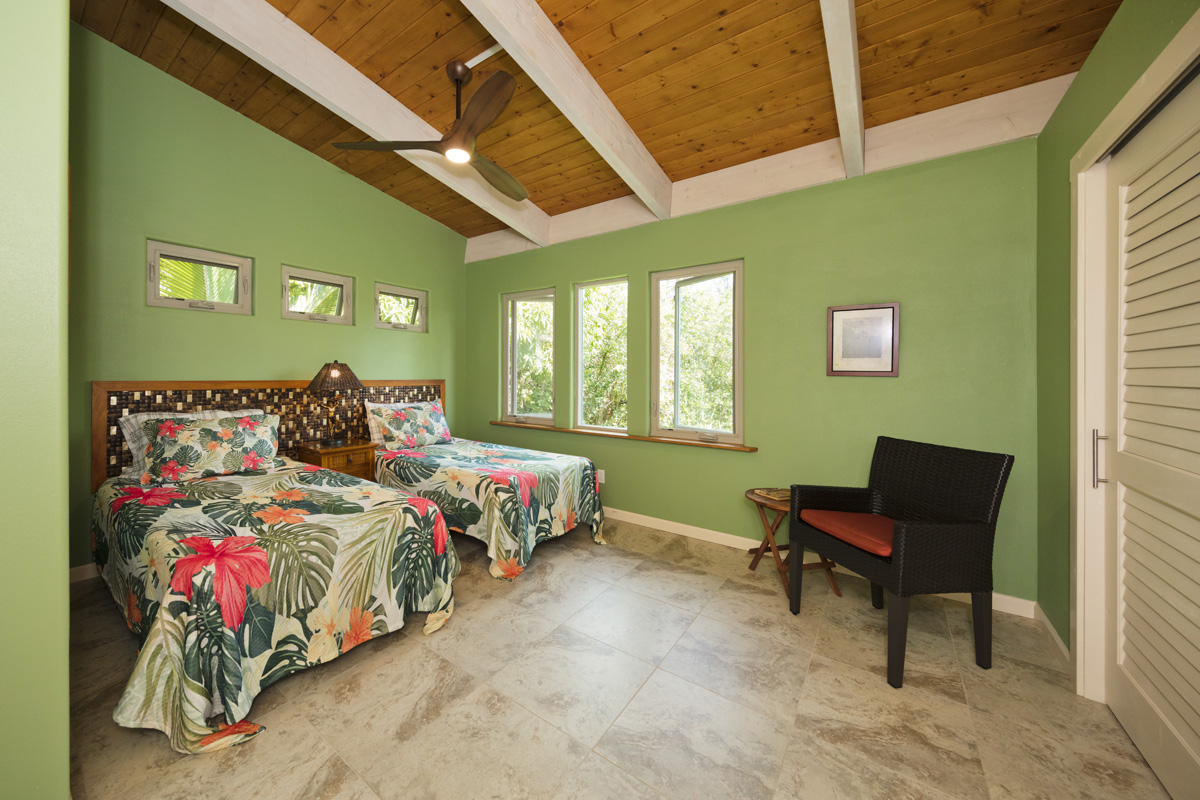 12-7002 Ho'Eunalu Street Pahoa, HI 96778 - Photo 20 of 26 a bedroom with bed and a window