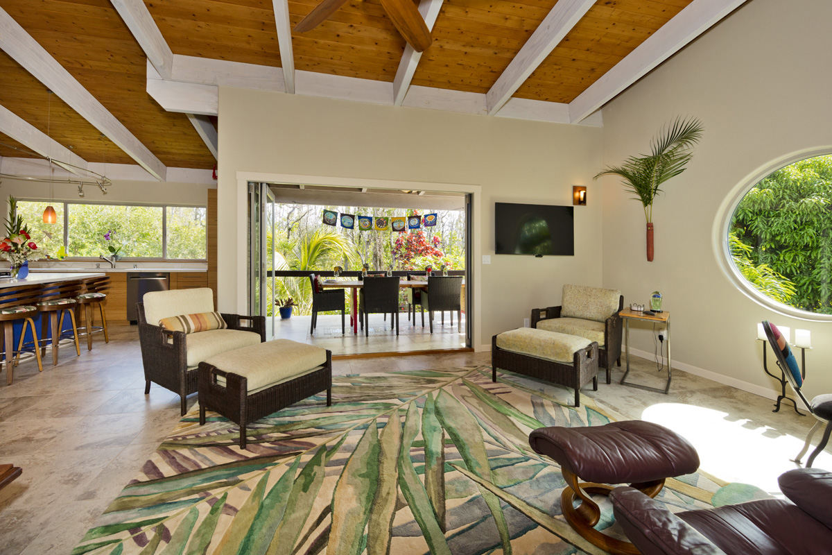 12-7002 Ho'Eunalu Street Pahoa, HI 96778 - Photo 3 of 26 a living room with furniture and a flat screen tv