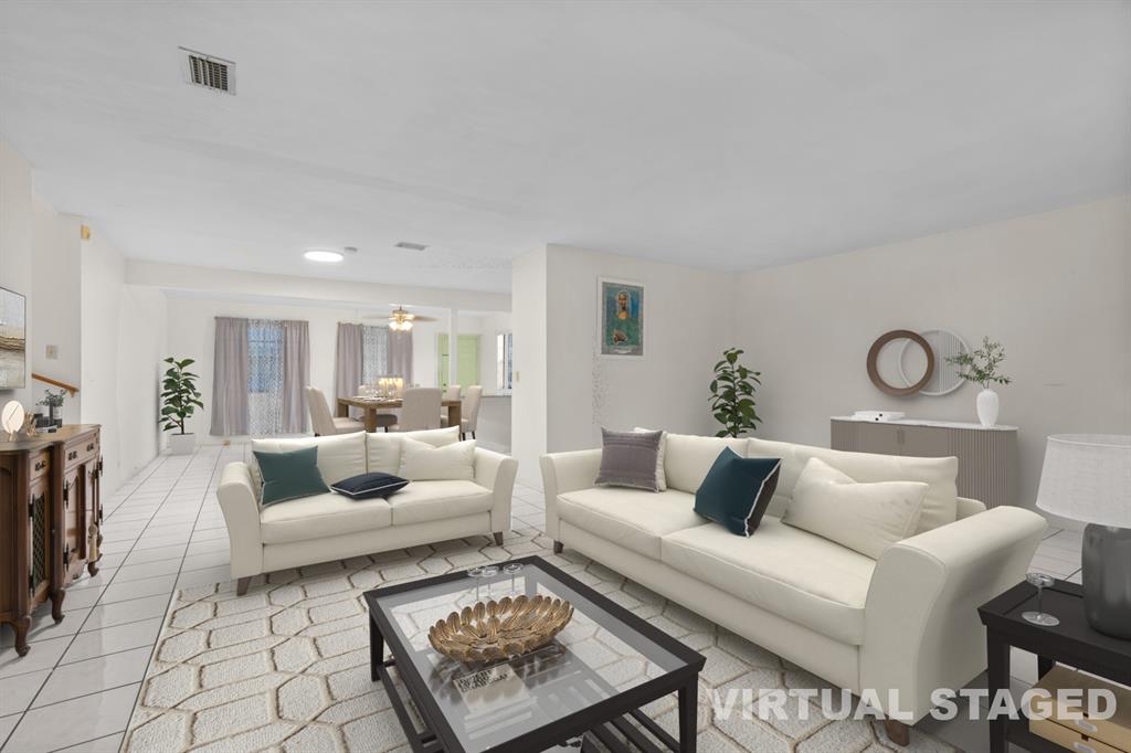 14800 Northeast 8th Court Miami, FL 33161 - Photo 21 of 37 a living room with furniture and a table
