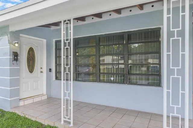 a view of front door and bedroom
