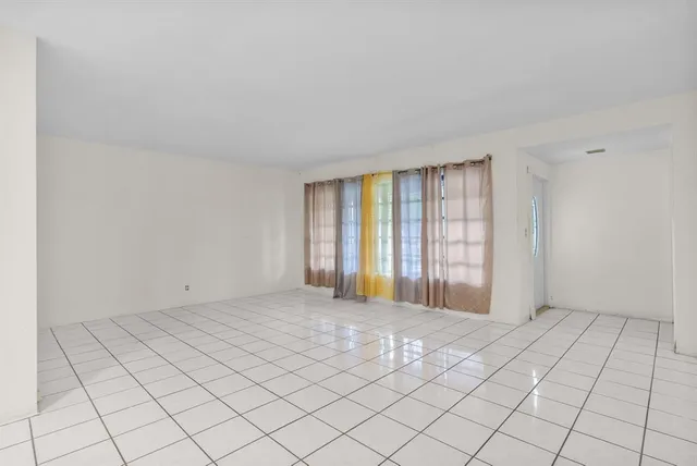 a view of an empty room and window