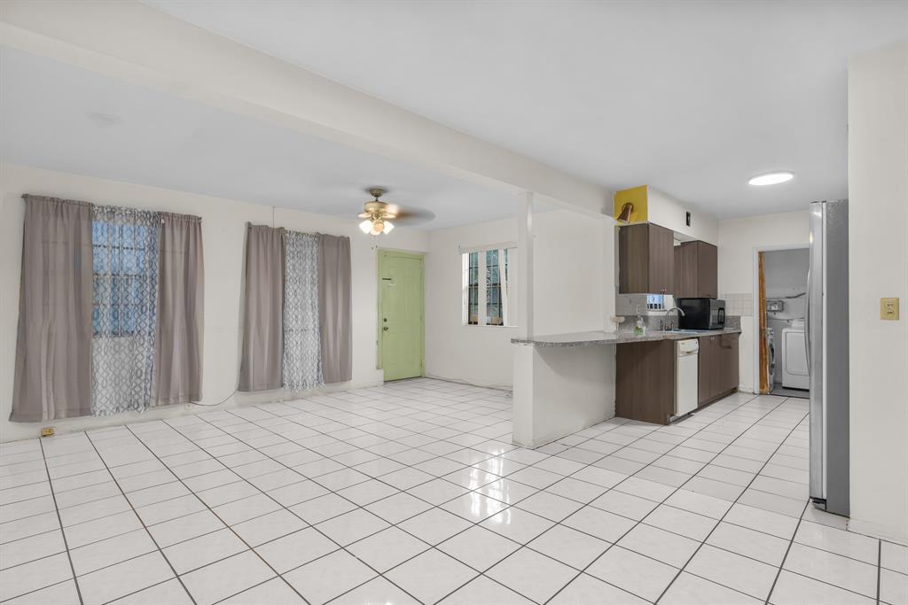 14800 Northeast 8th Court Miami, FL 33161 - Photo 7 of 37 a large white kitchen with a sink and cabinets