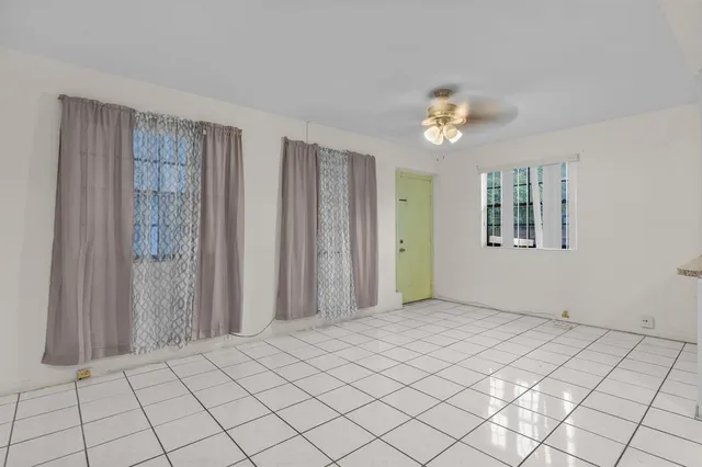 a view of an empty room and window