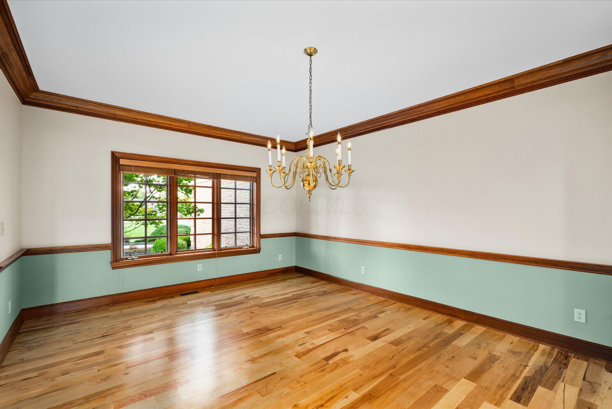 18261 Boerger Road Marysville, OH 43040 - Photo 10 of 94 Dining room with chair rail, crown molding and beautiful refinished wood floors