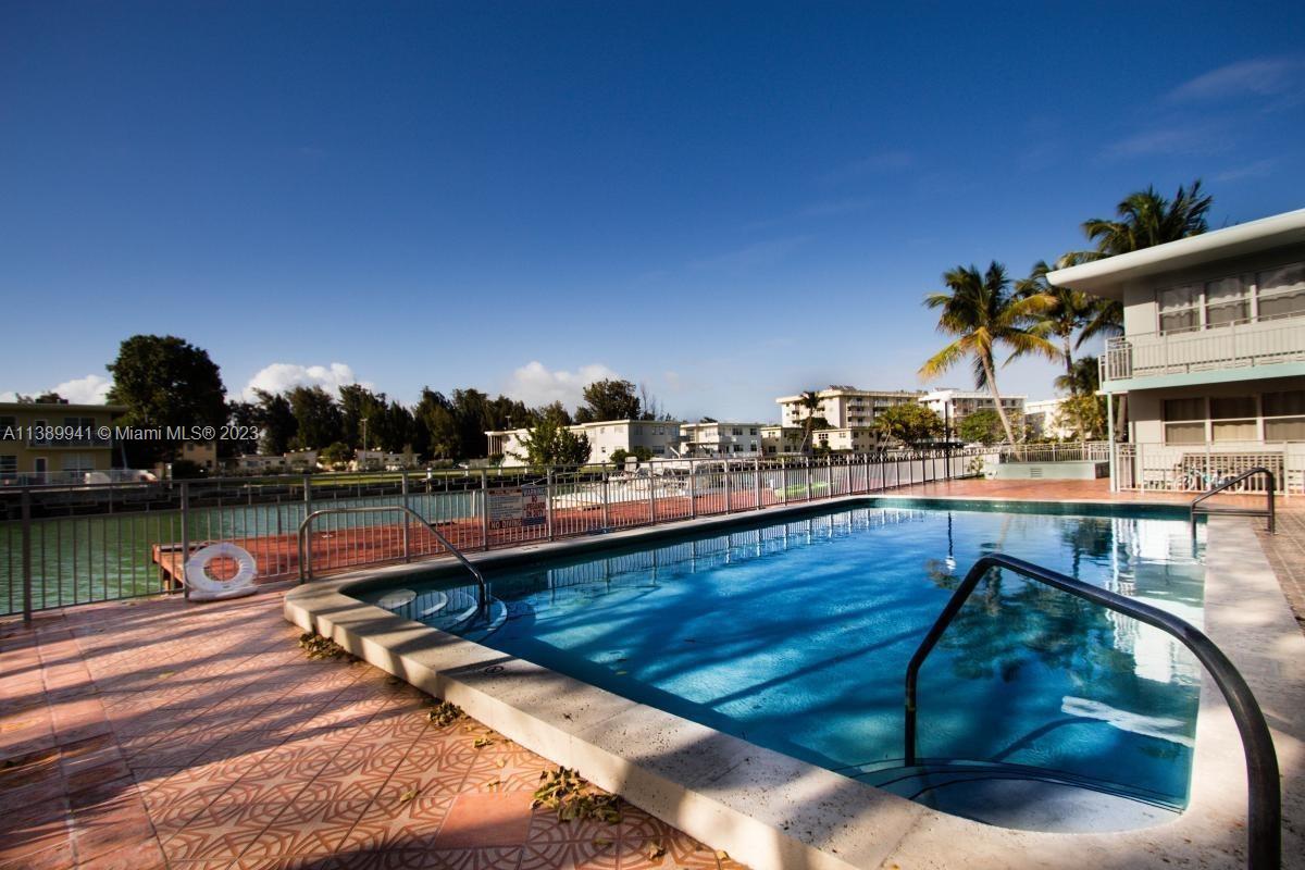 Normandy Isle Miami Beach, FL 33141 - Photo 11 of 13 a view of a lake with couches chairs