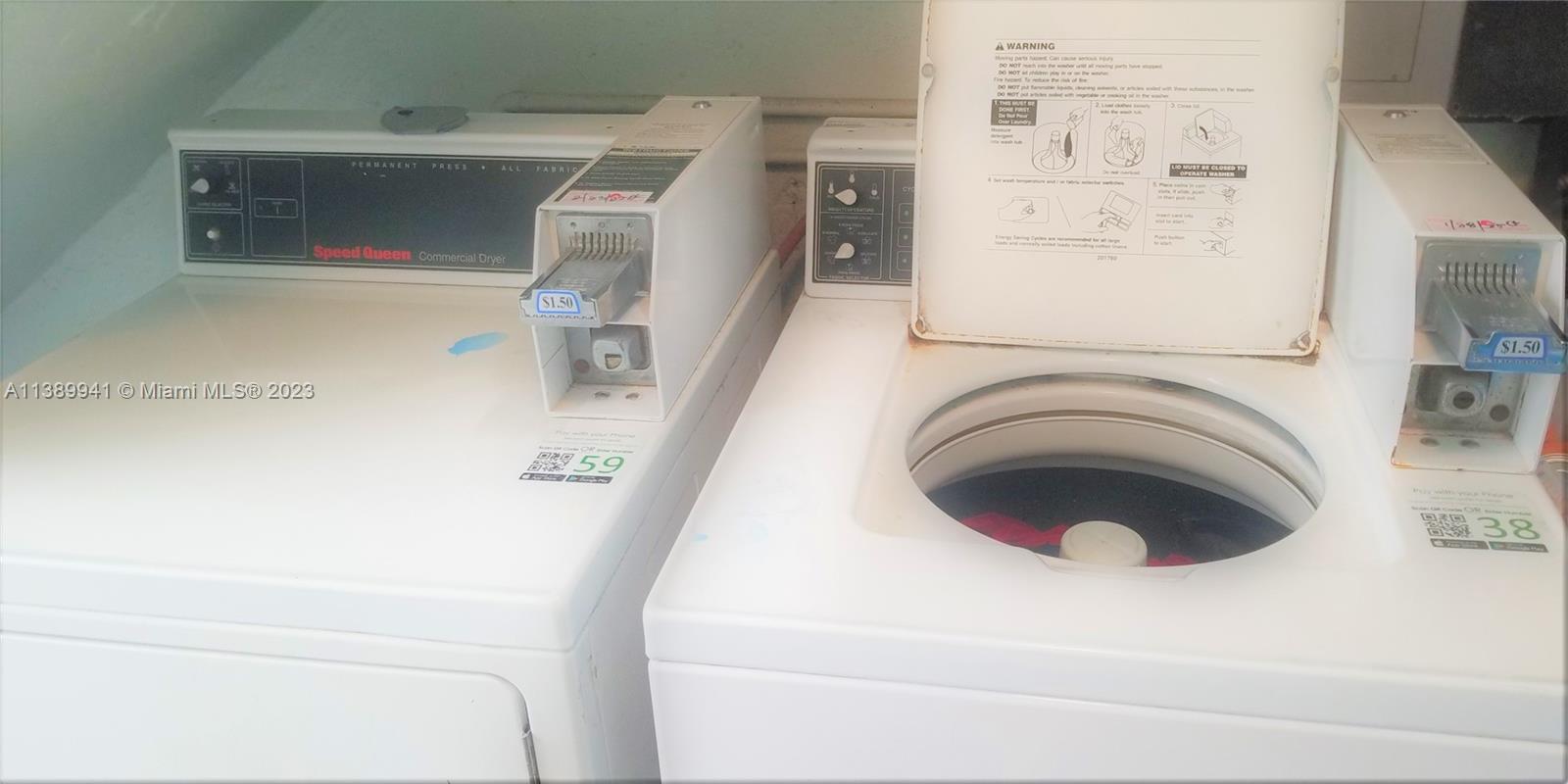 Normandy Isle Miami Beach, FL 33141 - Photo 12 of 13 a utility room with dryer and washer