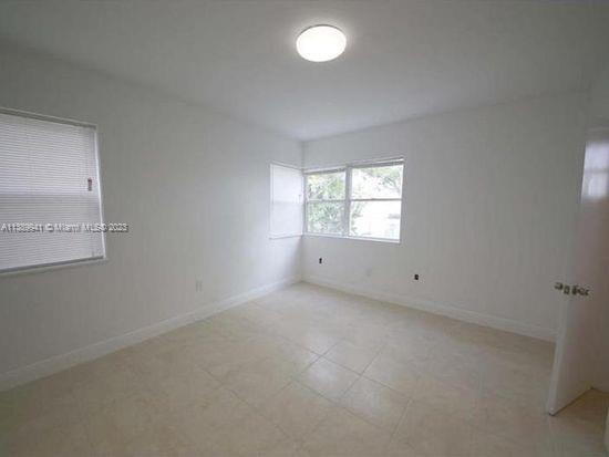 Normandy Isle Miami Beach, FL 33141 - Photo 5 of 13 an empty room with windows