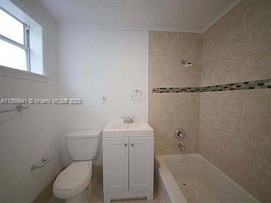 Normandy Isle Miami Beach, FL 33141 - Photo 8 of 13 a bathroom with a sink a toilet and shower