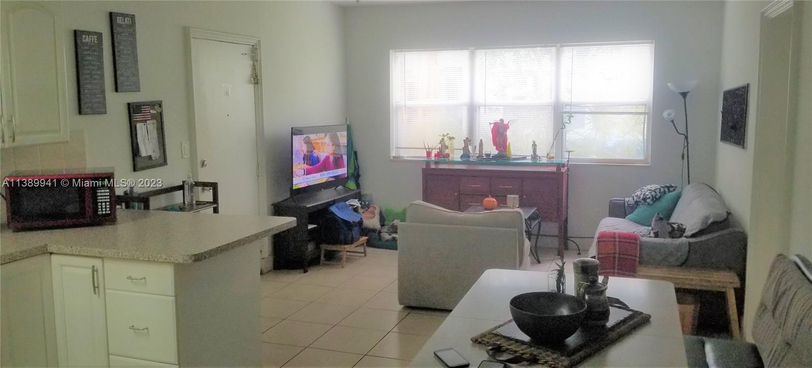 Normandy Isle Miami Beach, FL 33141 - Photo 10 of 13 a room with furniture and a window